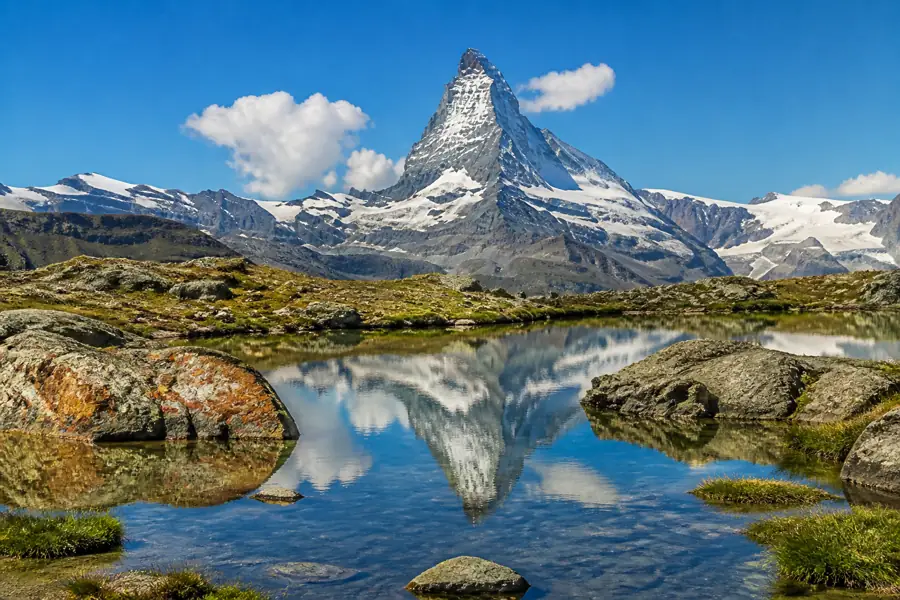 Swiss Alps peaks and alpine lake